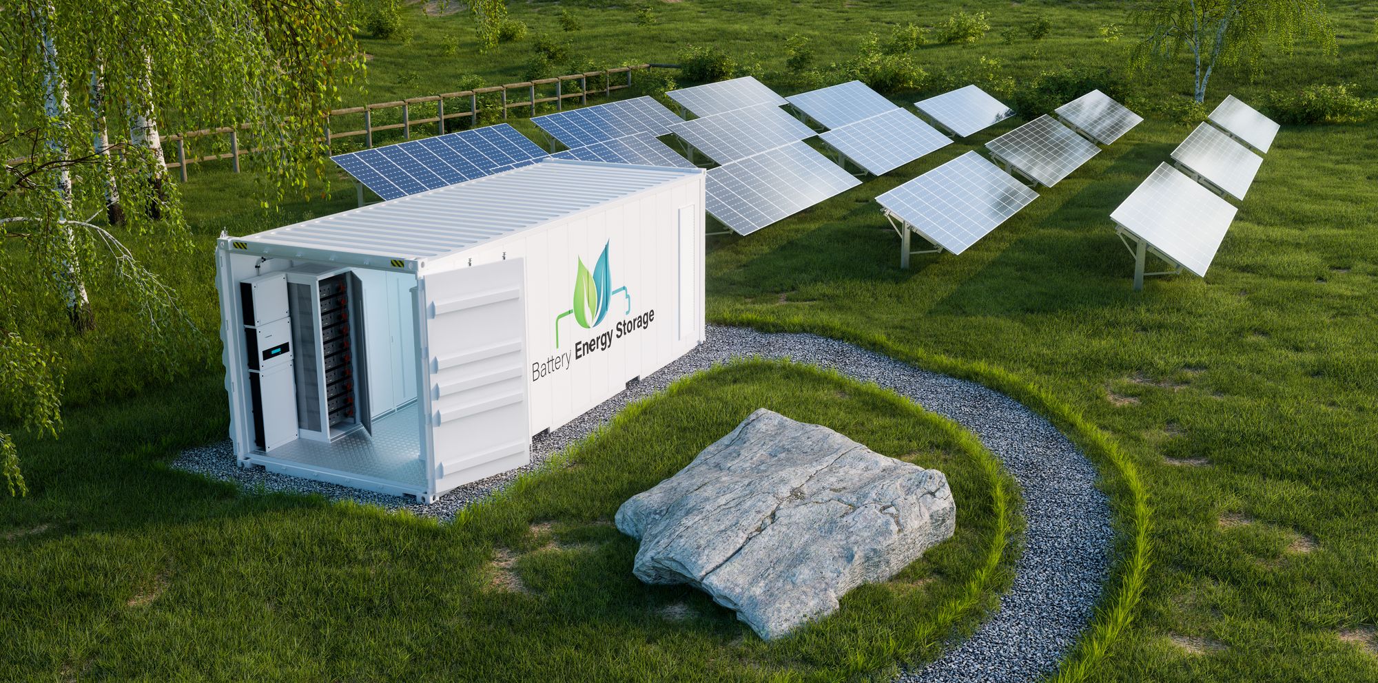 Batteriespeicher-Container neben Solarmodulen auf der Wiese